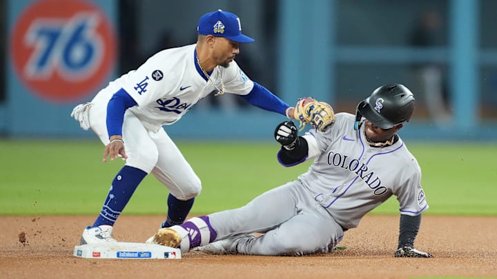 Apr 15, 2025; Los Angeles, California, USA; Colorado Rockies second baseman Adael Amador (1) is safe at second against Los Angeles Dodgers shortstop Mookie Betts (50) in the second inning at Dodger Stadium. All players wore #42 for Jackie Robinson Day. Mandatory Credit: Kirby Lee-Imagn Images