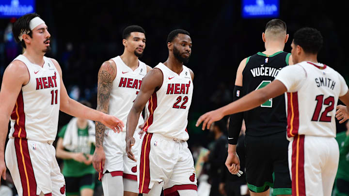 Feb 6, 2026; Boston, Massachusetts, USA;  Miami Heat forward Andrew Wiggins (22) I congratulated by his teammates during the first half against the Boston Celtics at TD Garden. Mandatory Credit: Bob DeChiara-Imagn Images