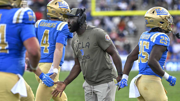 Nov 30, 2024; Pasadena, California, USA; UCLA Bruins head coach DeShaun Foster greets his players after a Bruins touchdown against the Fresno State Bulldogs in the third quarter at Rose Bowl. Mandatory Credit: Robert Hanashiro-Imagn Images