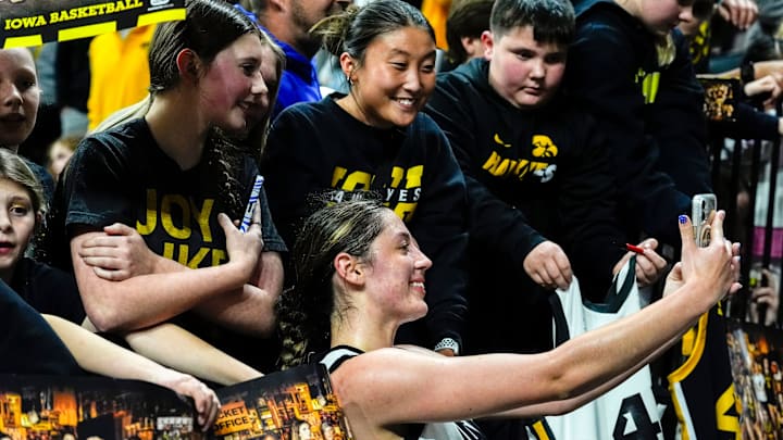 Iowa guard Addie Deal (7) takes a selfie with fans after the Hawkeyes defeated the Western Illinois Leathernecks Nov. 26, 2025 at Carver-Hawkeye Arena in Iowa City, Iowa.