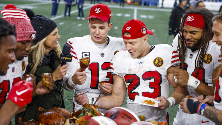 San Francisco 49ers quarterback Brock Purdy (13), running back Christian McCaffrey (23) and linebacker Fred Warner (54)
