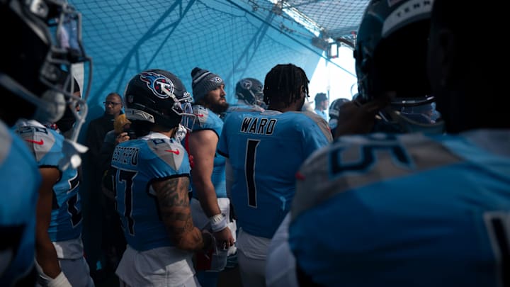 Tennessee Titans teammates wide receiver Xavier Restrepo (87) and quarterback Cam Ward (1)