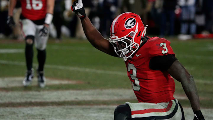 Georgia running back Nate Frazier (3) celebrates after driving in for the game winning score during overtime of a NCAA college football game against Georgia Tech in Athens, Ga., on Friday, Nov. 29, 2024.