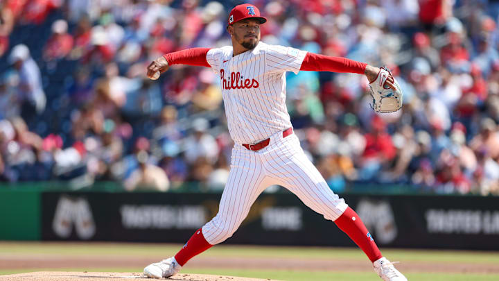 Mar 8, 2025; Clearwater, Florida, USA; Philadelphia Phillies pitcher Taijuan Walker (99) throws a pitch against the Toronto Blue Jays in the first inning during spring training at BayCare Ballpark. 