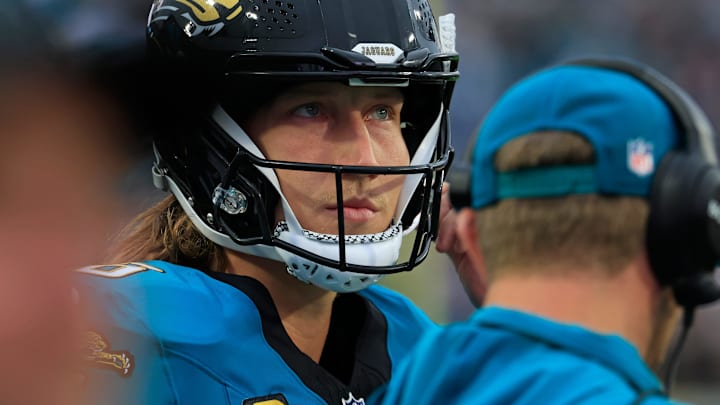 Jacksonville Jaguars quarterback Trevor Lawrence (16) looks on near head coach Liam Coen during the first quarter of an NFL football game at EverBank Stadium, Sunday, Dec. 7, 2025, in Jacksonville, Fla. The Jaguars defeated the Colts 36-19.