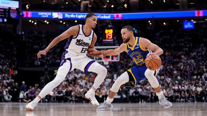 Apr 16, 2024; Sacramento, California, USA; Golden State Warriors guard Stephen Curry (30) is guarded by Sacramento Kings forward Keegan Murray (13). Apr 16, 2024; Sacramento, California, USA; Golden State Warriors guard Stephen Curry (30) is guarded by Sacramento Kings forward Keegan Murray (13).