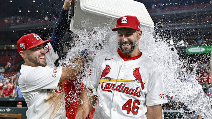 Paul Goldschmidt (46) is doused with water by center fielder Michael Siani 