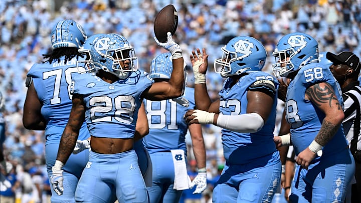 North Carolina Tar Heels running back Omarion Hampton celebrates a rushing touchdown. 