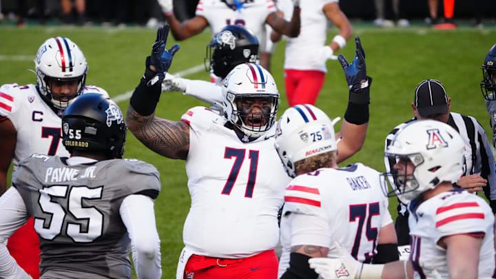 Nov 11, 2023; Boulder, Colorado, USA; Arizona Wildcats offensive lineman Jonah Savaiinaea (71) celebrates defeating the against the Colorado Buffaloes at Folsom Field. Nov 11, 2023; Boulder, Colorado, USA; Arizona Wildcats offensive lineman Jonah Savaiinaea (71) celebrates defeating the against the Colorado Buffaloes at Folsom Field.