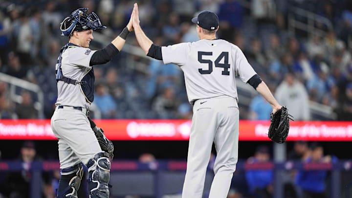 Jun 28, 2024; Toronto, Ontario, CAN; New York Yankees catcher Ben Rice (93) celebrates the win with New York Yankees relief pitcher Tim Hill (54) against the Toronto Blue Jays at Rogers Centre. Mandatory Credit: Nick Turchiaro-Imagn Images