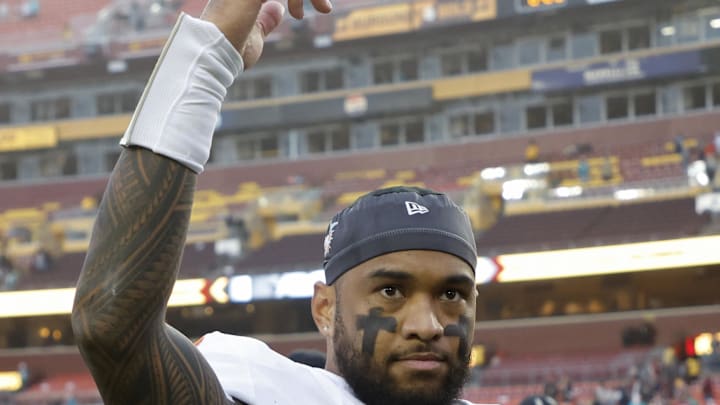 Dec 3, 2023; Landover, Maryland, USA; Miami Dolphins quarterback Tua Tagovailoa (1) waves to fans