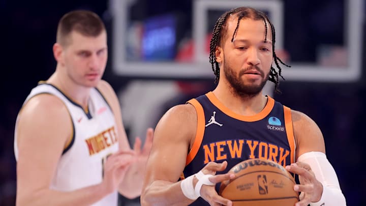 Jan 25, 2024; New York, New York, USA; Denver Nuggets center Nikola Jokic (15) asks for the ball as New York Knicks guard Jalen Brunson (11) inspects it before their game at Madison Square Garden. Mandatory Credit: Brad Penner-Imagn Images