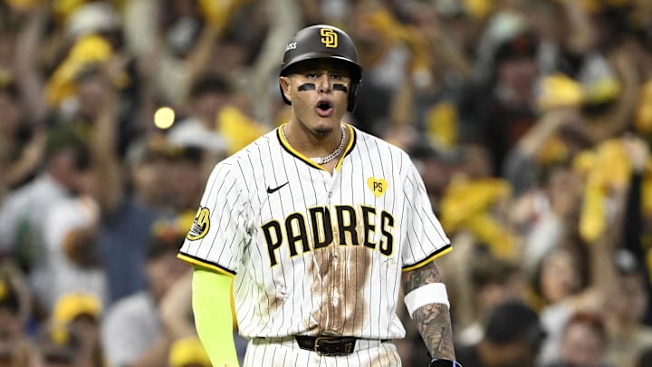 Oct 8, 2024; San Diego, California, USA; San Diego Padres third baseman Manny Machado (13) celebrates after making it to third on an error in the second inning against the Los Angeles Dodgers during game three of the NLDS for the 2024 MLB Playoffs at Petco Park.  Mandatory Credit: Denis Poroy-Imagn Images