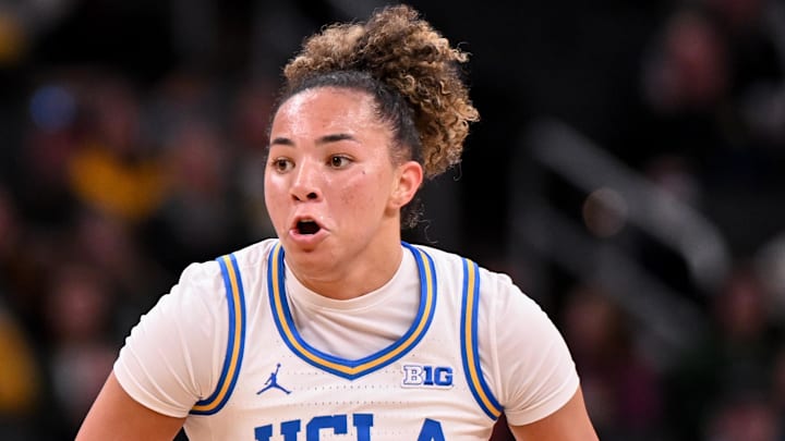 Mar 7, 2026; Indianapolis, IN, USA; UCLA Bruins guard Kiki Rice (1) dribbles the ball against the Ohio State Buckeyes during the first half at Gainbridge Fieldhouse. Mandatory Credit: Robert Goddin-Imagn Images