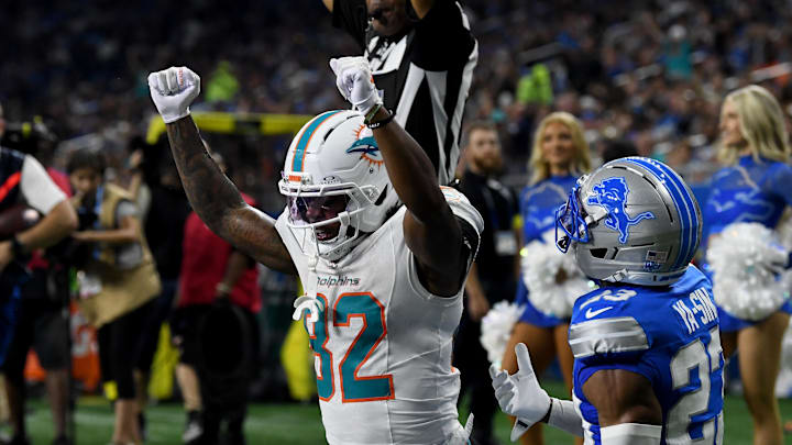Miami Dolphins wide receiver Dee Eskridge (82) celebrates after scoring a touchdown against the Detroit Lions in the first quarter at Ford Field.