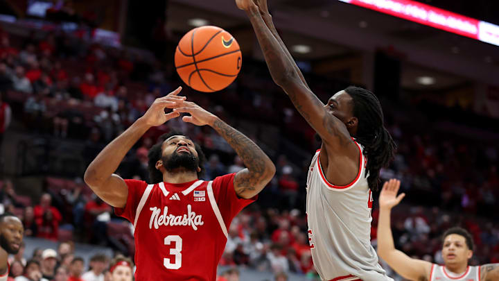 Nebraska  guard Brice Williams loses the ball as Ohio State forward Aaron Bradshaw defends during the first half Tuesday night.