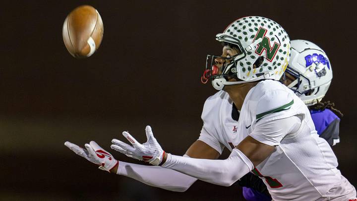 Lawrence North High School sophomore Monshun Sales (1) makes a reception for a 38-yard gain during the first half of an IHSAA Class 6A Regional Championship game against Brownsburg High School, Friday, Nov. 15, 2024, at Brownsburg High School. Lawrence North High School sophomore Monshun Sales (1) makes a reception for a 38-yard gain during the first half of an IHSAA Class 6A Regional Championship game against Brownsburg High School, Friday, Nov. 15, 2024, at Brownsburg High School.