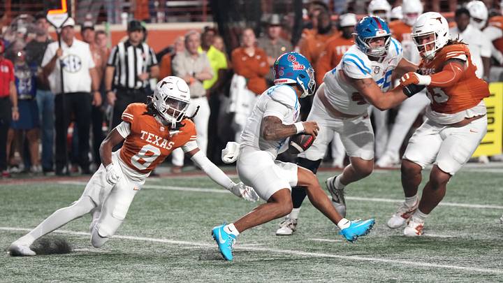 Oct 24, 2026; Austin, Texas, USA; Mississippi Rebels quarterback Trinidad Chambliss (6) is tackled by Texas Longhorns defensive back Kade Phillips (8) during the first half at Darrell K Royal-Texas Memorial Stadium. Mandatory Credit: Scott Wachter-Imagn Images Oct 24, 2026; Austin, Texas, USA; Mississippi Rebels quarterback Trinidad Chambliss (6) is tackled by Texas Longhorns defensive back Kade Phillips (8) during the first half at Darrell K Royal-Texas Memorial Stadium. Mandatory Credit: Scott Wachter-Imagn Images