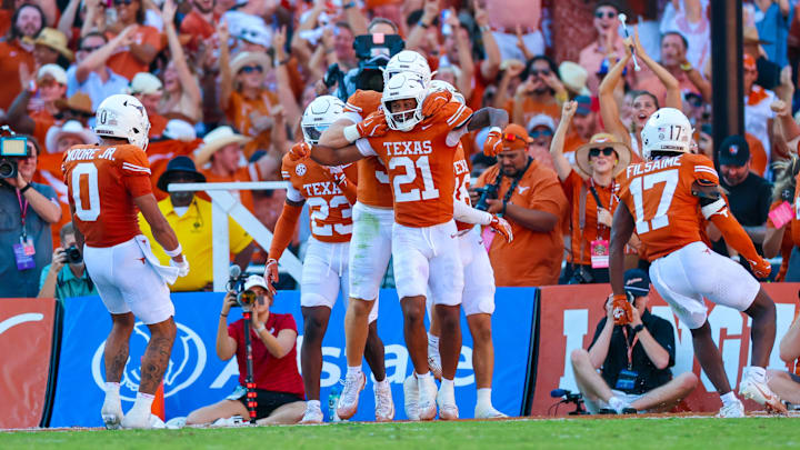 Texas Longhorns defensive back Ryan Niblett (21) celebrates with teammates after returning a punt for a touchdown during the second half against the Oklahoma Sooners at the Cotton Bowl. Texas Longhorns defensive back Ryan Niblett (21) celebrates with teammates after returning a punt for a touchdown during the second half against the Oklahoma Sooners at the Cotton Bowl.