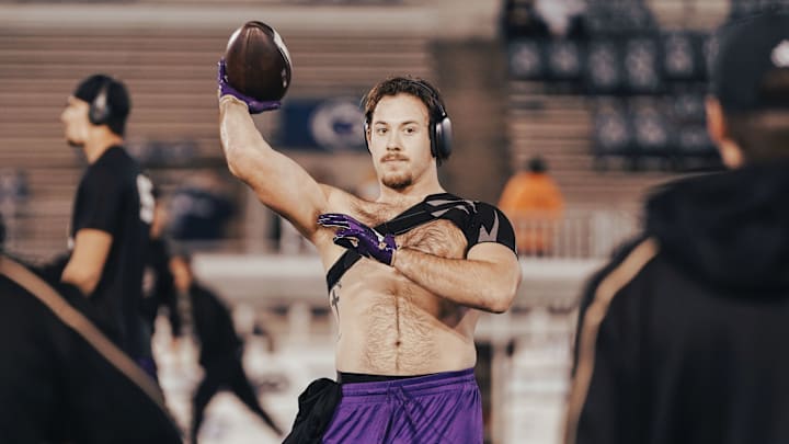Carson Bruener warmed up Penn State shirtless, with his shoulder brace visible. 