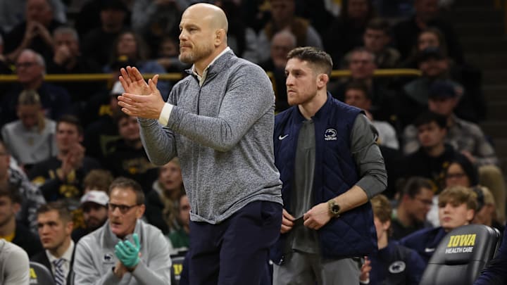 Penn State Nittany Lions wrestling coach Cael Sanderson watches his team wrestle the Iowa Hawkeyes at Carver-Hawkeye Arena. Penn State Nittany Lions wrestling coach Cael Sanderson watches his team wrestle the Iowa Hawkeyes at Carver-Hawkeye Arena.