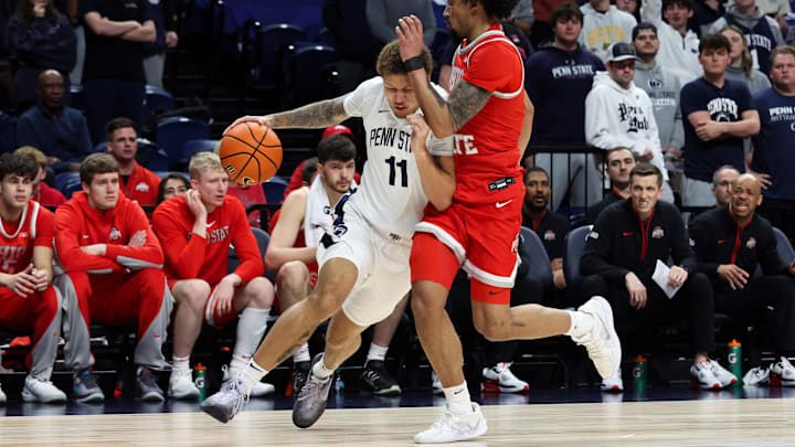 Mar 4, 2026; University Park, Pennsylvania, USA; Penn State Nittany Lions guard Eli Rice (11) drives the ball towards the basket as Ohio State Buckeyes guard Taison Chatman (3) defends during the first half at Bryce Jordan Center. Mandatory Credit: Matthew O'Haren-Imagn Images