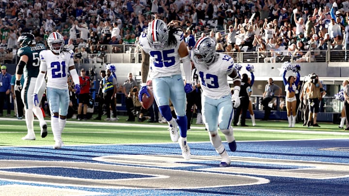  Dallas Cowboys linebacker Marist Liufau and linebacker DeMarvion Overshown react to recovering a fumble in the second quarter against the Philadelphia Eagles at AT&T Stadium. 