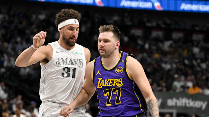 Apr 9, 2025; Dallas, Texas, USA; Dallas Mavericks guard Klay Thompson (31) and Los Angeles Lakers guard Luka Doncic (77) in action during the game between the Dallas Mavericks and the Los Angeles Lakers at American Airlines Center. Mandatory Credit: Jerome Miron-Imagn Images