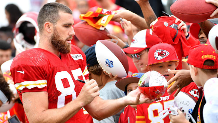 Jul 29, 2018; St. Joseph, MO, USA; Kansas City Chiefs tight end Travis Kelce (87) signs autographs for fans after training camp at Missouri Western State University. Mandatory Credit: Denny Medley-Imagn Images