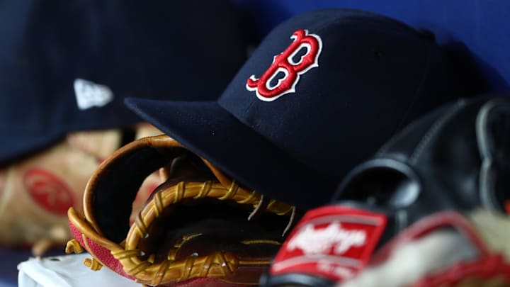 Sep 20, 2019; St. Petersburg, FL, USA; A detail view of Boston Red Sox hats and gloves at Tropicana