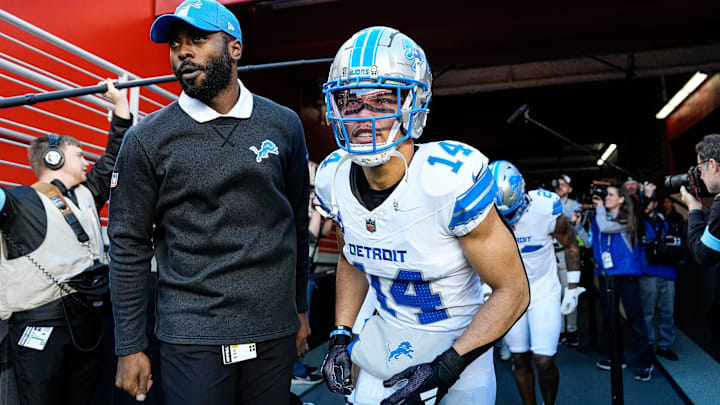 Detroit Lions wide receiver Amon-Ra St. Brown (14) next to assistant quarterbacks coach J.T Barrett and teammates take the field for warm up before the game between San Francisco 49ers and Detroit Lions at Levi's Stadium in Santa Clara, Calif. on Monday, Dec. 30, 2024.