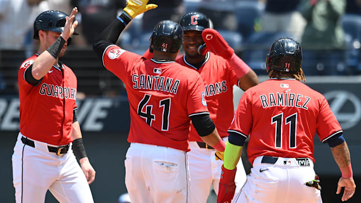 Jun 11, 2025; Cleveland, Ohio, USA; Cleveland Guardians first baseman Carlos Santana (41) celebrates with third baseman Jose Ramirez (11) and center fielder Lane Thomas (8) and second baseman Angel Martinez (1) after hitting a grand slam home run during the third inning against the Cincinnati Reds at Progressive Field. Mandatory Credit: Ken Blaze-Imagn Images