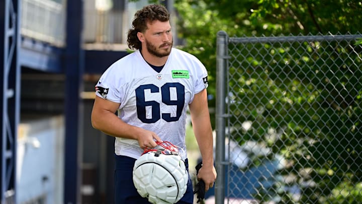 Jul 26, 2023; Foxborough, MA, USA; New England Patriots guard Cole Strange (69) makes his way to the practice fields for  training camp at Gillette Stadium. Mandatory Credit: Eric Canha-Imagn Images