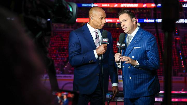 Jun 14, 2025; Edmonton, Alberta, CAN; Sportsnet host David Amber (left) and NHL Insider Elliotte Friedman (right) prior to the game between the Edmonton Oilers and the Florida Panthers in game five of the 2025 Stanley Cup Final at Rogers Place. Mandatory Credit: Sergei Belski-Imagn Images