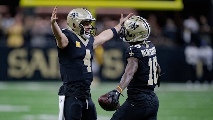 Nov 10, 2024; New Orleans, Louisiana, USA; New Orleans Saints wide receiver Marquez Valdes-Scantling (10) celebrates a touchdown with New Orleans Saints quarterback Derek Carr (4) against the Atlanta Falcons during the first half at Caesars Superdome. Mandatory Credit: Matthew Hinton-Imagn Images