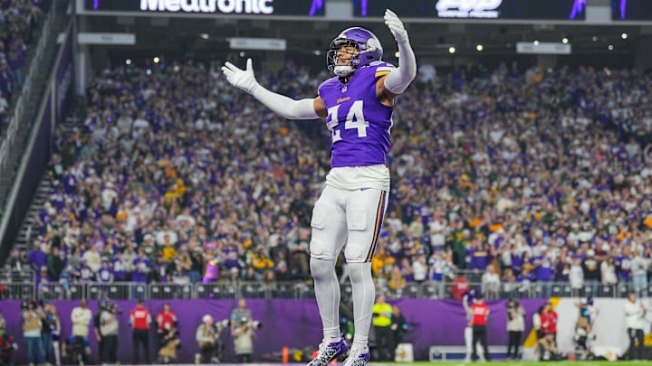 Dec 29, 2024; Minneapolis, Minnesota, USA; Minnesota Vikings safety Camryn Bynum (24) interacts with fans against Green Bay Packers in the first quarter at U.S. Bank Stadium. Mandatory Credit: Brad Rempel-Imagn Images