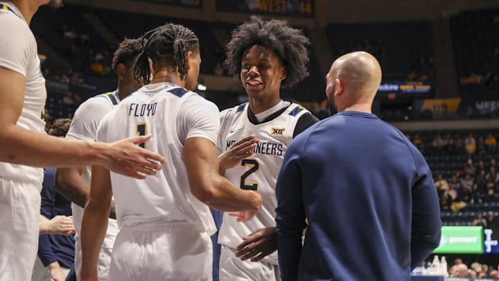 Dec 3, 2025; Morgantown, West Virginia, USA; West Virginia Mountaineers guard Amir Jenkins (2) celebrates with West Virginia Mountaineers guard Jasper Floyd (1) during the second half against the Coppin State Eagles at Hope Coliseum. Mandatory Credit: Ben Queen-Imagn Images Dec 3, 2025; Morgantown, West Virginia, USA; West Virginia Mountaineers guard Amir Jenkins (2) celebrates with West Virginia Mountaineers guard Jasper Floyd (1) during the second half against the Coppin State Eagles at Hope Coliseum. Mandatory Credit: Ben Queen-Imagn Images