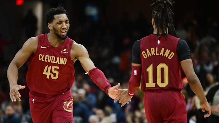 Feb 14, 2024; Cleveland, Ohio, USA; Cleveland Cavaliers guard Donovan Mitchell (45) celebrates with guard Darius Garland (10) during the second half against the Chicago Bulls at Rocket Mortgage FieldHouse. Mandatory Credit: Ken Blaze-Imagn Images