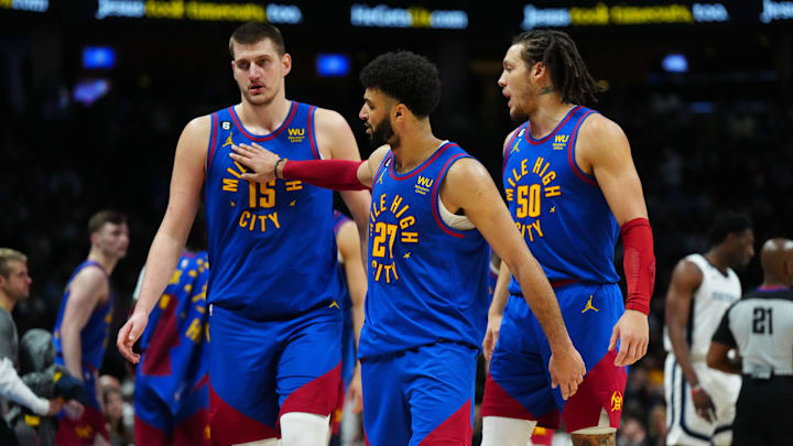 Mar 3, 2023; Denver, Colorado, USA; Denver Nuggets center Nikola Jokic (15) and guard Jamal Murray (27) and forward Aaron Gordon (50) celebrate after defeating the Memphis Grizzlies at Ball Arena. Mandatory Credit: Ron Chenoy-Imagn Images