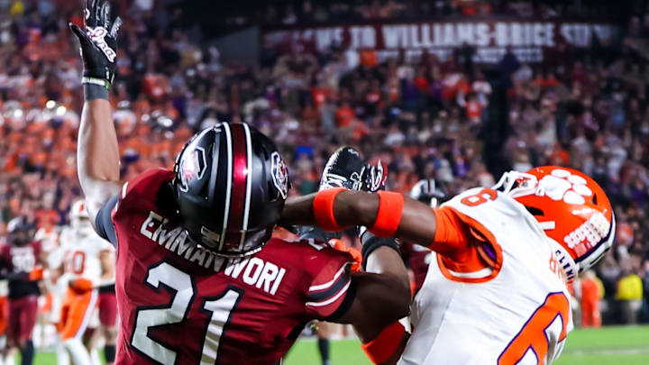 Nov 25, 2023; Columbia, South Carolina, USA; South Carolina Gamecocks defensive back Nick Emmanwori (21) intercepts a pass intended for Clemson Tigers wide receiver Tyler Brown (6) in the second half at Williams-Brice Stadium. Mandatory Credit: Jeff Blake-Imagn Images Nov 25, 2023; Columbia, South Carolina, USA; South Carolina Gamecocks defensive back Nick Emmanwori (21) intercepts a pass intended for Clemson Tigers wide receiver Tyler Brown (6) in the second half at Williams-Brice Stadium. Mandatory Credit: Jeff Blake-Imagn Images