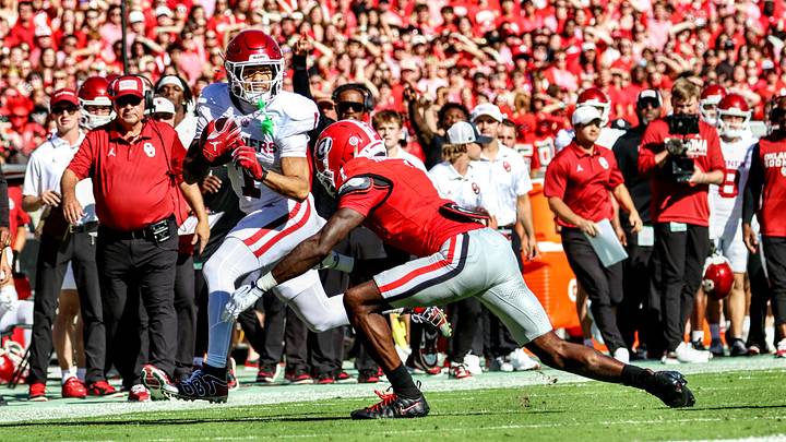 Oklahoma wide receiver Isaiah Sategna tries to break a tackle against Georgia. Oklahoma wide receiver Isaiah Sategna tries to break a tackle against Georgia.