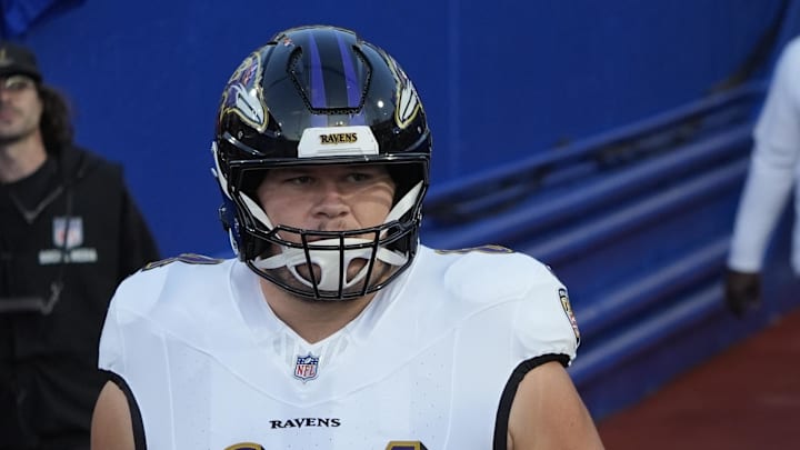 Sep 7, 2025; Orchard Park, New York, USA;  Baltimore Ravens center Tyler Linderbaum (64) and center Corey Bullock (67) enter the field for warm up prior to the game against the Buffalo Bills at Highmark Stadium. Mandatory Credit: Gregory Fisher-Imagn Images