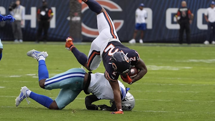 Dallas Cowboys cornerback Kaiir Elam tackles Chicago Bears wide receiver DJ Moore during the second half at Soldier Field. 
