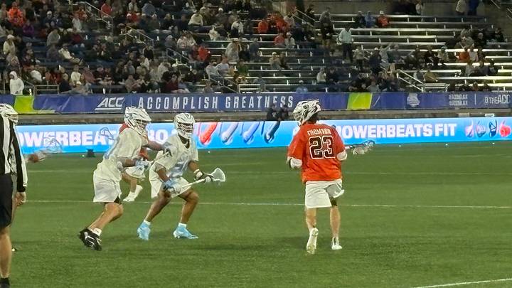 Syracuse attack Finn Thomson, who scored three times, is guarded by North Carolina's defense in the third quarter of Friday night's ACC Tournament semifinal game in Charlotte. 