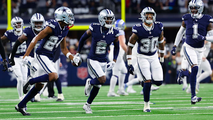 Dec 30, 2023; Arlington, Texas, USA; Dallas Cowboys cornerback Jourdan Lewis (2) celebrates with teammates after making an interception during the first half against the Detroit Lions at AT&T Stadium. Mandatory Credit: Kevin Jairaj-Imagn Images