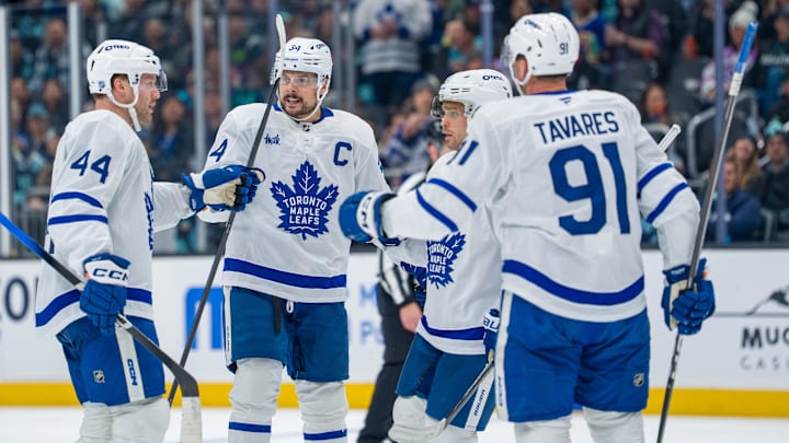 Jan 29, 2026; Seattle, Washington, USA; Toronto Maple Leafs, from left, defenseman Morgan Rielly (44), forward Auston Matthews (34), forward Max Domi (11) and forward John Tavares (91) celebrate a goal during the third period at Climate Pledge Arena. Mandatory Credit: Stephen Brashear-Imagn Images