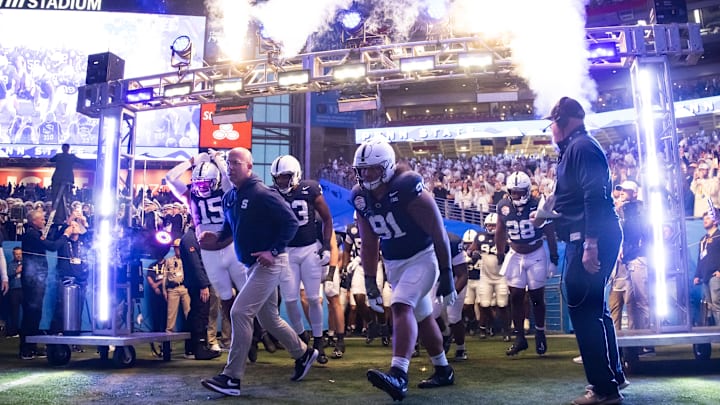 Penn State coach James Franklin leads the Nittany Lions onto the field for the 2024 Fiesta Bowl against Boise State.