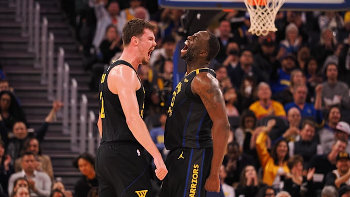 Feb 3, 2025; San Francisco, California, USA; Golden State Warriors center Quinten Post (21) and forward Draymond Green (23) celebrate after a play against the Orlando Magic during the third quarter at Chase Center. Mandatory Credit: Kelley L Cox-Imagn Images Feb 3, 2025; San Francisco, California, USA; Golden State Warriors center Quinten Post (21) and forward Draymond Green (23) celebrate after a play against the Orlando Magic during the third quarter at Chase Center. Mandatory Credit: Kelley L Cox-Imagn Images