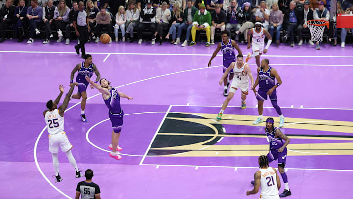 Nov 17, 2023; Salt Lake City, Utah, USA; Phoenix Suns forward Nassir Little (25) shoots a three point shot over Utah Jazz forward Kelly Olynyk (41) in the third quarter at Delta Center. Mandatory Credit: Rob Gray-Imagn Images