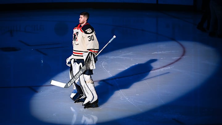 Milwaukee Admirals goaltender Yaroslav Askarov stands in the spotlight during pregame ceremonies before a game against the Texas Stars on Friday, January 19, 2024, at the UW-Milwaukee Panther Arena in Milwaukee, Wisconsin.
